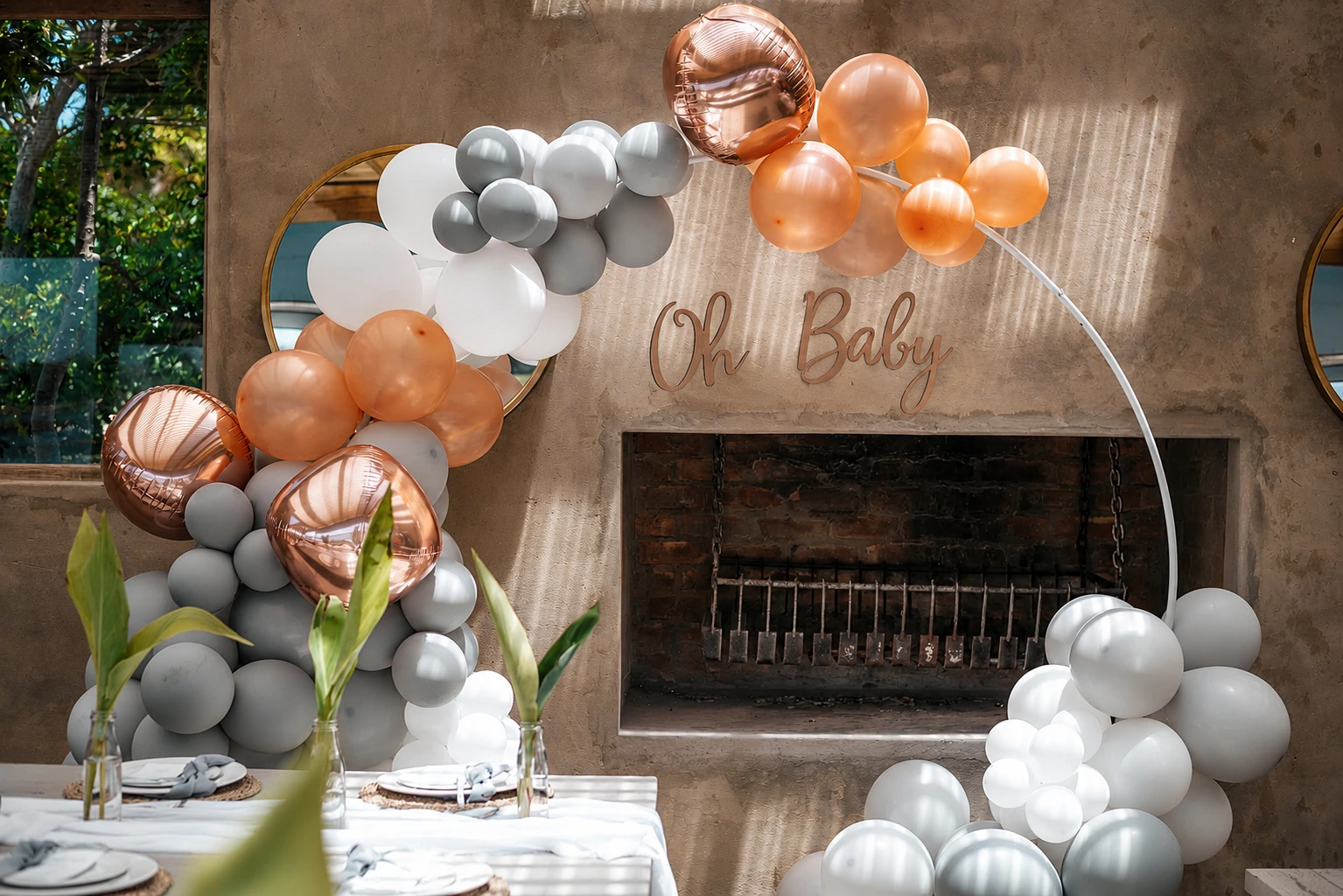 Pastel baby shower styling with elegant balloons, flowers and celebration decor