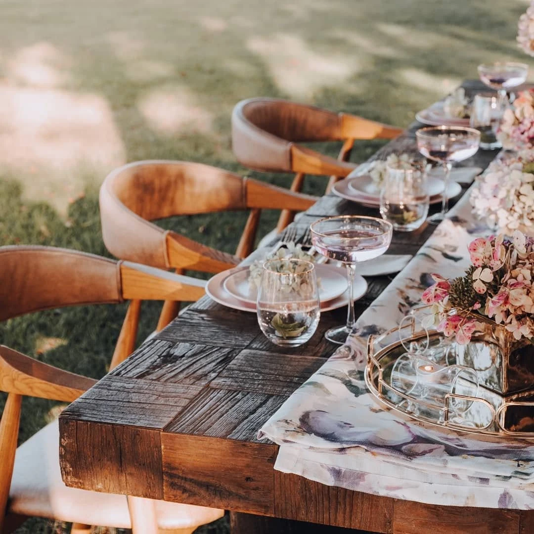 Elegant pastel event styling with coordinated balloons, flowers and table decor
