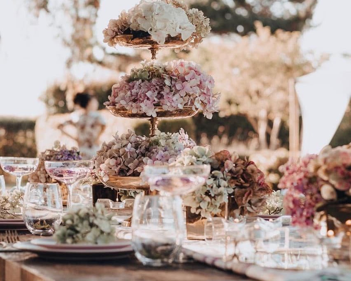 Event styling details including flowers, tableware and coordinated celebration decor